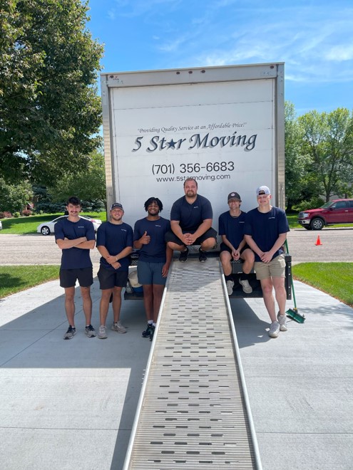 5 Star Moving team members in front of moving truck